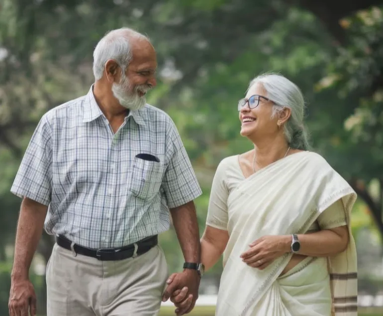 Elderly-Indian-couple-walking-hand-in-hand,-symbolising-active-ageing-and-muscle-strength-supported-by-ImproSyn-and-Care-for-Muscles.