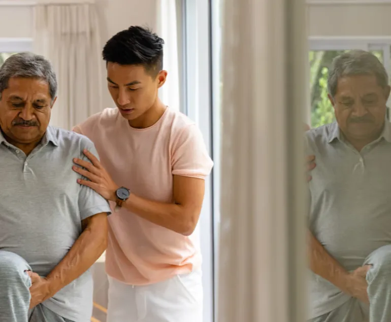 diverse-male-physiotherapist-advising-senior-male-patient-stretching-leg-physiotherapy-healthcare-wellbeing-senior-lifestyle-unaltered-(1)-(1)