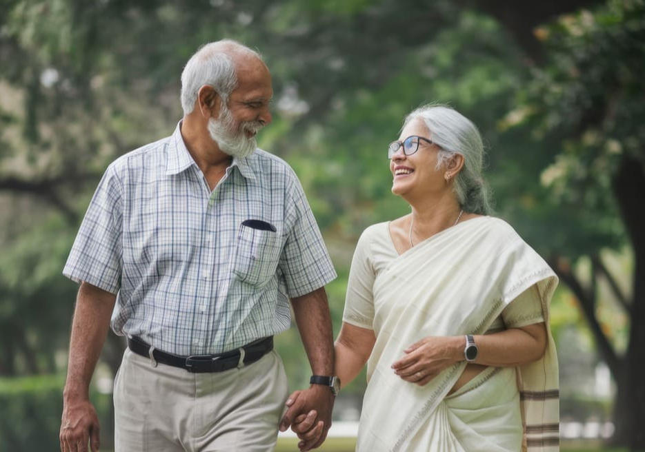 Elderly-Indian-couple-walking-hand-in-hand,-symbolising-active-ageing-and-muscle-strength-supported-by-ImproSyn-and-Care-for-Muscles.
